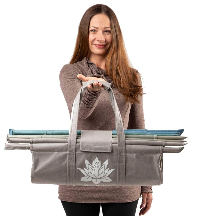 woman holding lotus trolley bags